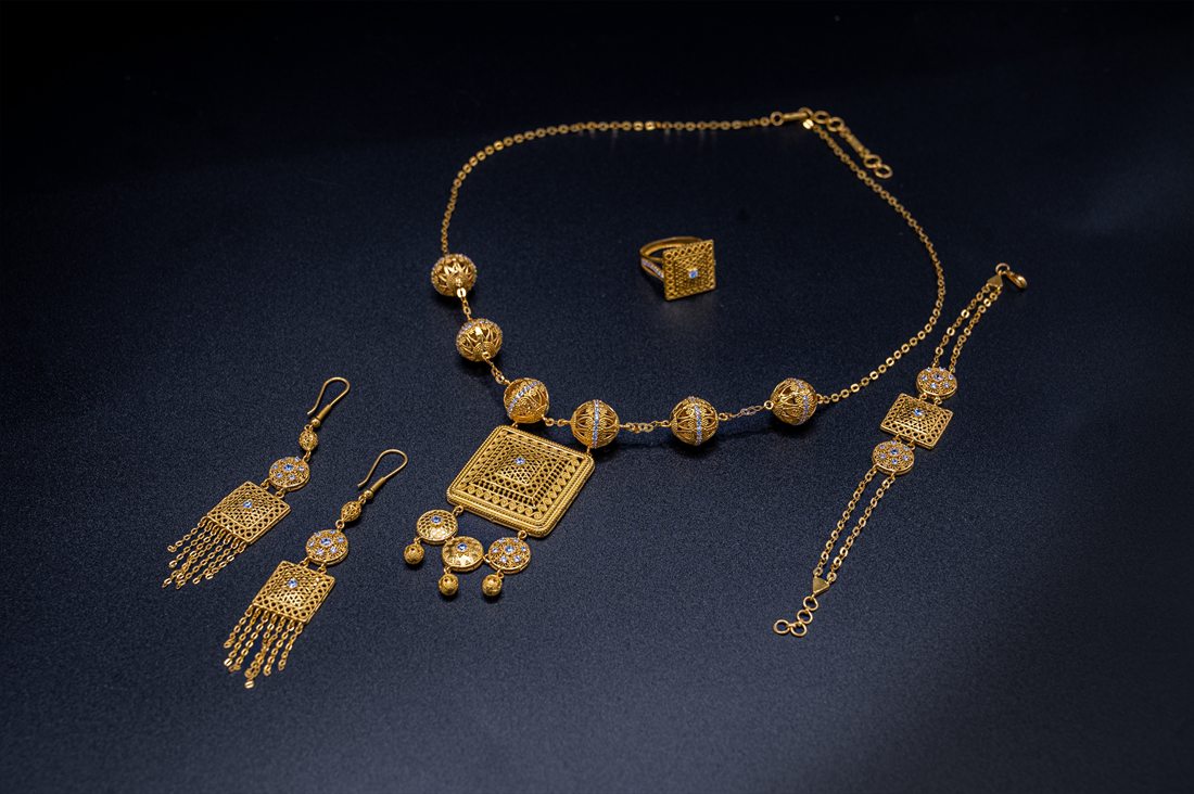 Dar Almusk — gold necklace, earrings, bracelet and ring